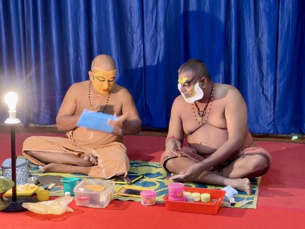 Kerala Kathakali Dancers applying their make up